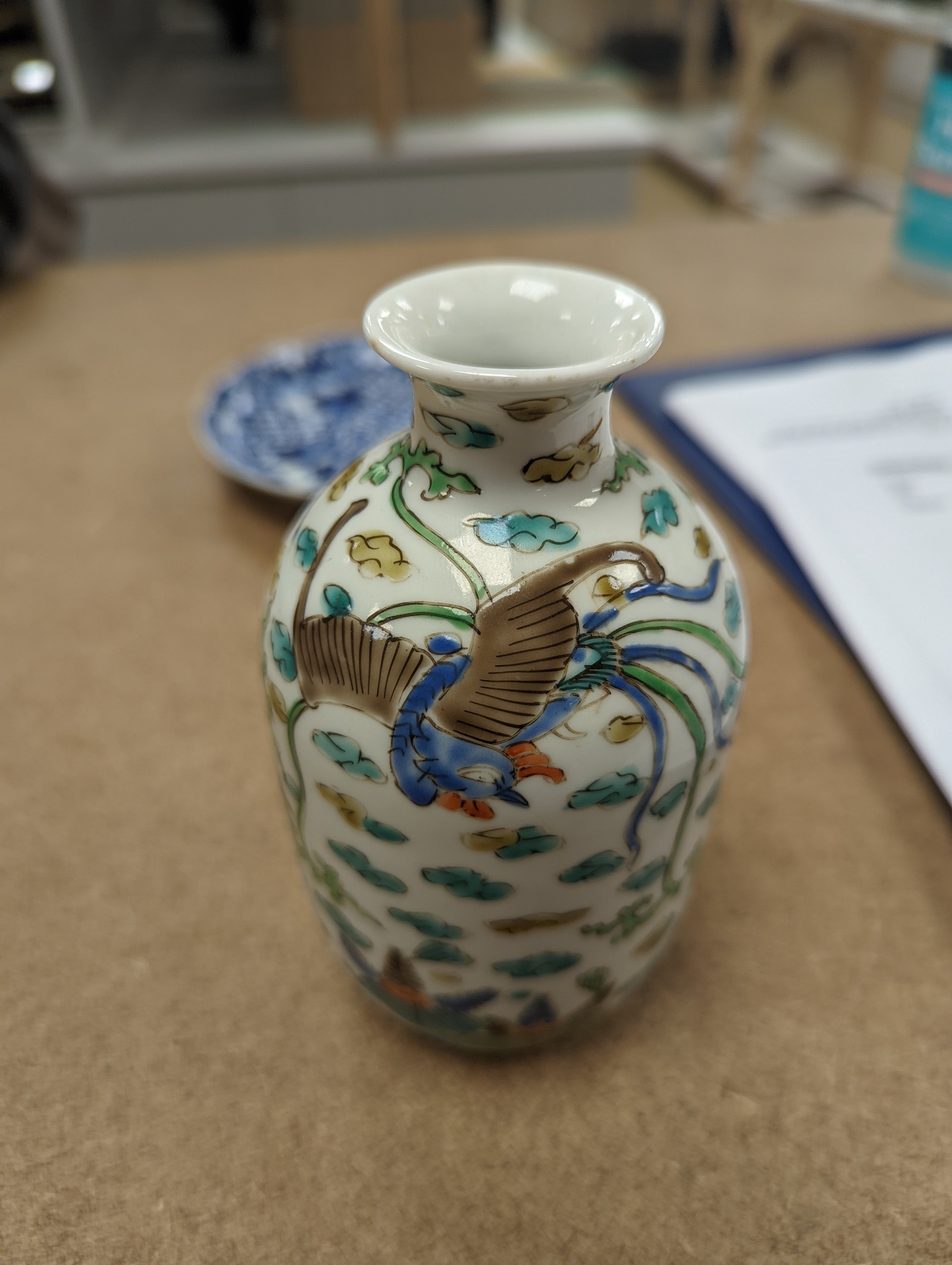 Two Chinese porcelain saucer dishes and an enamelled porcelain vase, 18th century and later, 12.5cm